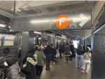 Variety of different signs here in this image at the 2nd Ave Station while the NYCTA Holiday Arnine Set rests in the background 